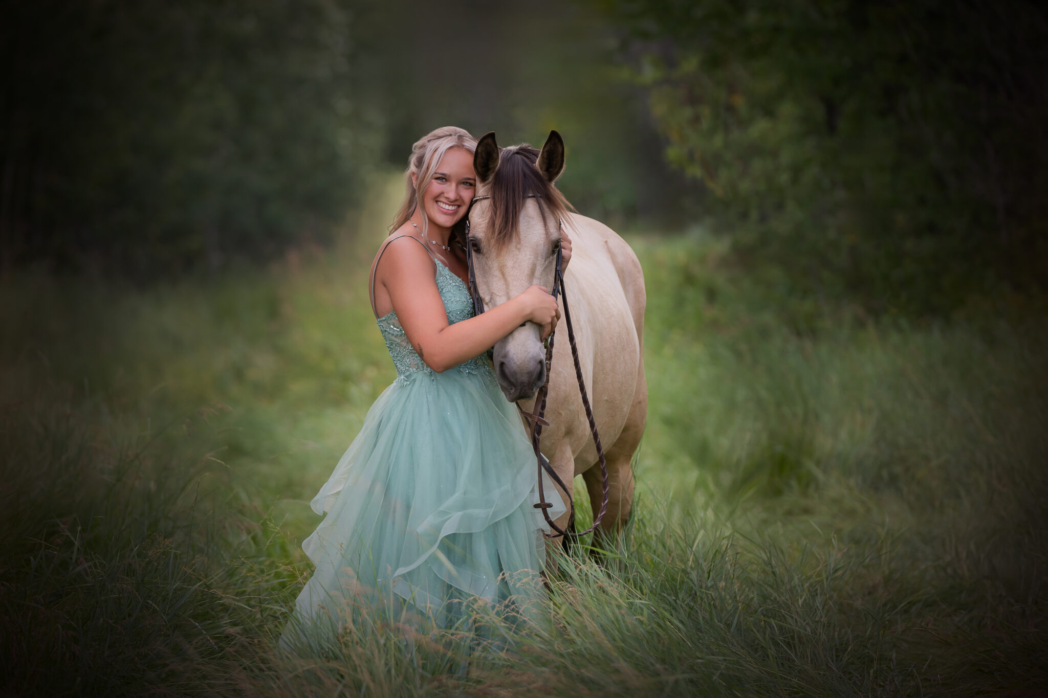 Graduate photographed with her horse on the family farm, in her favourite spot, a path in a back meadow